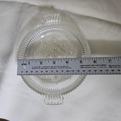 Pressed glass collection of bowls, platters, and candlesticks