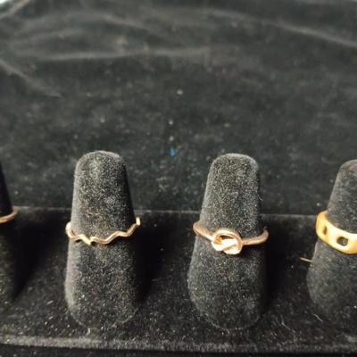6 GOLD TONE RINGS