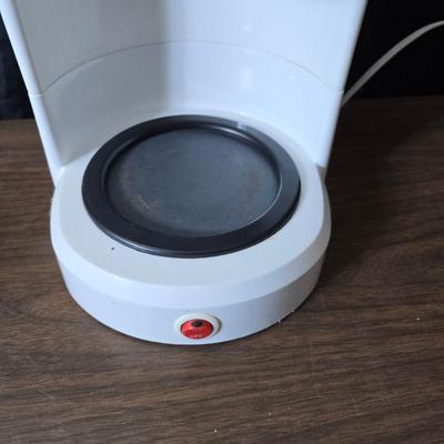 Sunbeam coffee maker with a selection of coffee mugs