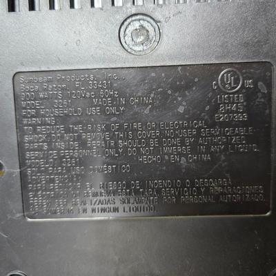 Sunbeam coffee maker with a selection of coffee mugs