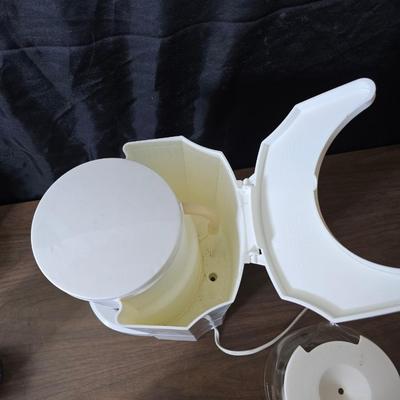 Sunbeam coffee maker with a selection of coffee mugs