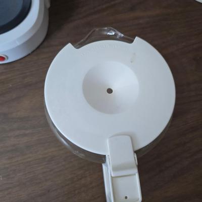 Sunbeam coffee maker with a selection of coffee mugs