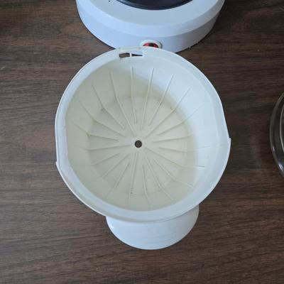 Sunbeam coffee maker with a selection of coffee mugs