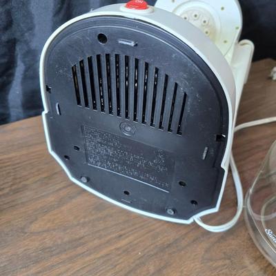 Sunbeam coffee maker with a selection of coffee mugs