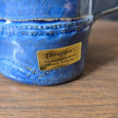 Sunbeam coffee maker with a selection of coffee mugs