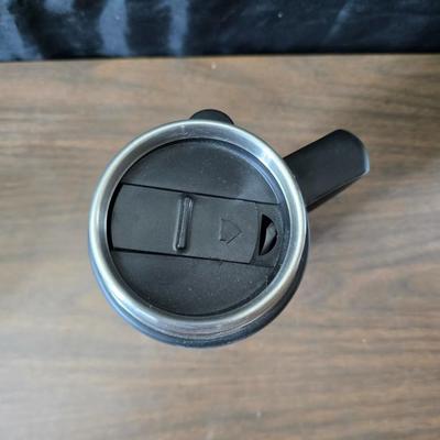 Sunbeam coffee maker with a selection of coffee mugs