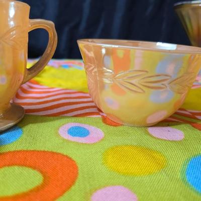 Fire king orange lusterware with a fun & funky vintage tablecloth