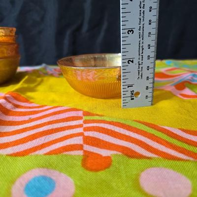Fire king orange lusterware with a fun & funky vintage tablecloth
