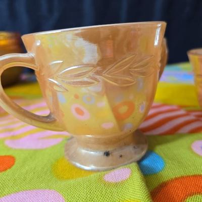Fire king orange lusterware with a fun & funky vintage tablecloth