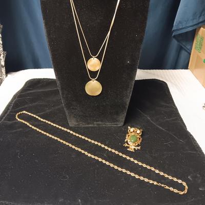 2 GOLD TONE NECKLACES AND AN OWL BROOCH