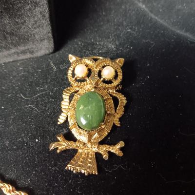 2 GOLD TONE NECKLACES AND AN OWL BROOCH