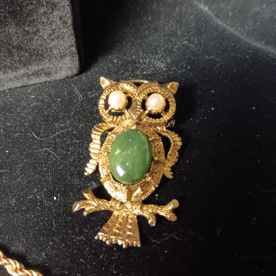 2 GOLD TONE NECKLACES AND AN OWL BROOCH