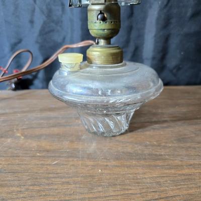 Small vintage oil lamp with electric cork adapter