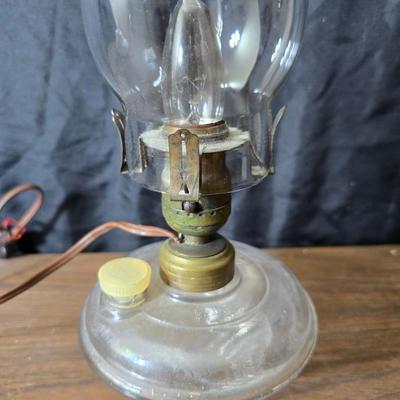 Small vintage oil lamp with electric cork adapter