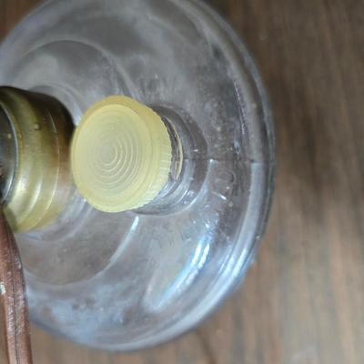 Small vintage oil lamp with electric cork adapter