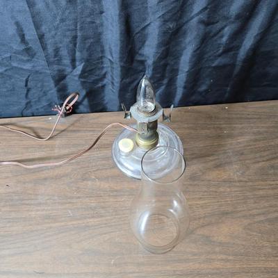 Small vintage oil lamp with electric cork adapter