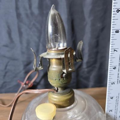 Small vintage oil lamp with electric cork adapter