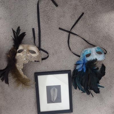 TWO MASQUERADE MASKS, ONE PHOTO