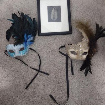 TWO MASQUERADE MASKS, ONE PHOTO