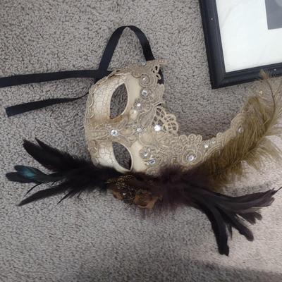 TWO MASQUERADE MASKS, ONE PHOTO
