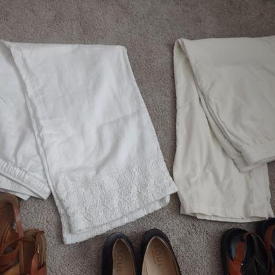 TWO WHITE DRESS PANTS, SANDALS, HOUSE SHOES.