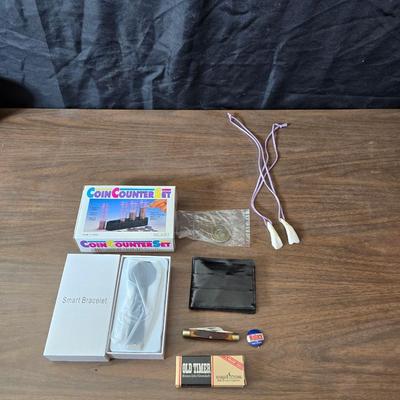 New Old timer pocketknife - large tooth necklaces - Coin counter = wallet and a new smart bracelet