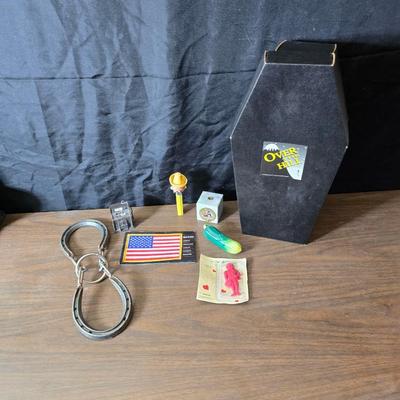 Collection of trinkets and gag gifts -cast Slot machine - iron on flag - Pez pal Pete with no feet -grow a date- horseshoe puzzle - over...