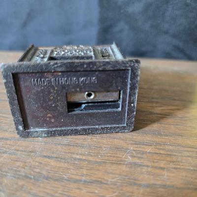 Collection of trinkets and gag gifts -cast Slot machine - iron on flag - Pez pal Pete with no feet -grow a date- horseshoe puzzle - over...