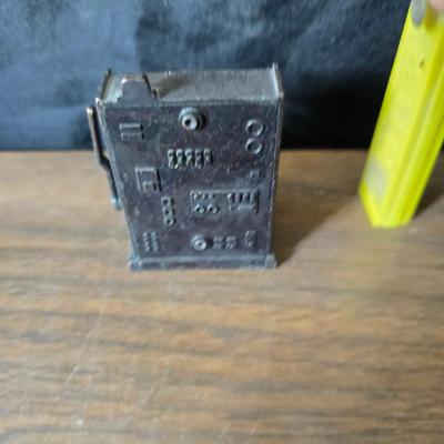 Collection of trinkets and gag gifts -cast Slot machine - iron on flag - Pez pal Pete with no feet -grow a date- horseshoe puzzle - over...