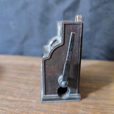 Collection of trinkets and gag gifts -cast Slot machine - iron on flag - Pez pal Pete with no feet -grow a date- horseshoe puzzle - over...