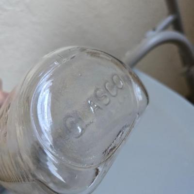Mobility aide walker and bedside toilet with a vintage glass urinal