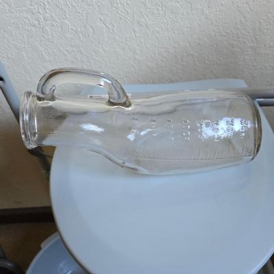 Mobility aide walker and bedside toilet with a vintage glass urinal