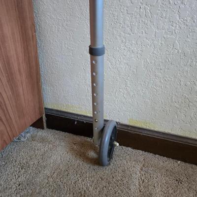 Mobility aide walker and bedside toilet with a vintage glass urinal