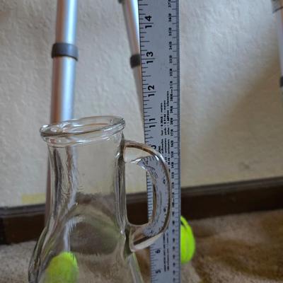 Mobility aide walker and bedside toilet with a vintage glass urinal