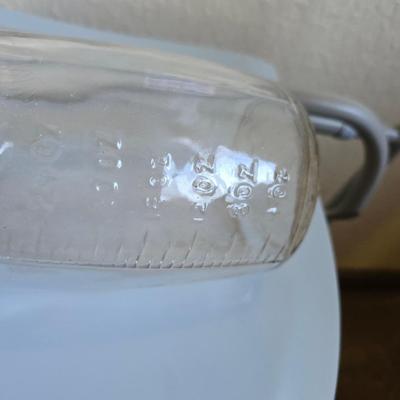 Mobility aide walker and bedside toilet with a vintage glass urinal