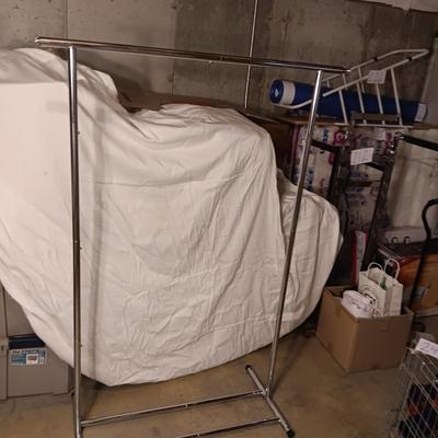 ADJUSTABLE CLOTHING RACK AND A FOLDING GARMENT RACK
