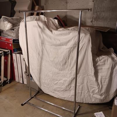 ADJUSTABLE CLOTHING RACK AND A FOLDING GARMENT RACK