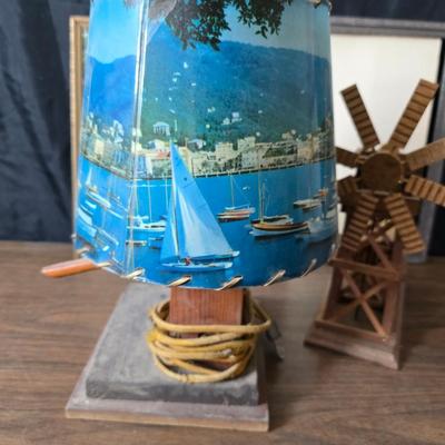 Collecion of vintage home decor - Antique picture frames with prints - windmill music box - old lamp with shade and two men in a canoe