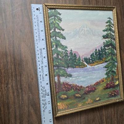 Collecion of vintage home decor - Antique picture frames with prints - windmill music box - old lamp with shade and two men in a canoe