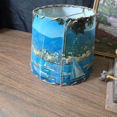 Collecion of vintage home decor - Antique picture frames with prints - windmill music box - old lamp with shade and two men in a canoe