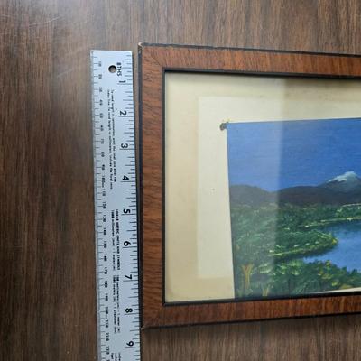 Collecion of vintage home decor - Antique picture frames with prints - windmill music box - old lamp with shade and two men in a canoe