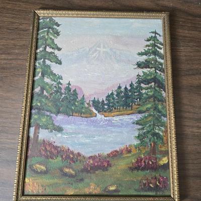 Collecion of vintage home decor - Antique picture frames with prints - windmill music box - old lamp with shade and two men in a canoe