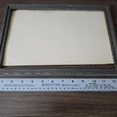 Collecion of vintage home decor - Antique picture frames with prints - windmill music box - old lamp with shade and two men in a canoe