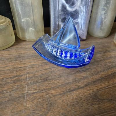 1930s Houze cobalt blue glass sailboat rocker ink blotter. with a collection of old bottles and some canning jars