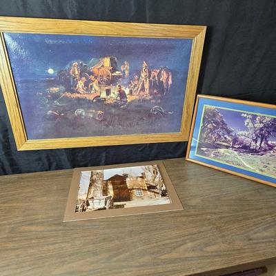 Framed print Laugh Kills Lonesome by artist Charles Marion Russell. with two other pieces of artwork