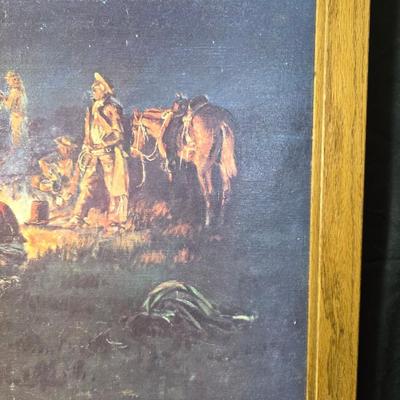 Framed print Laugh Kills Lonesome by artist Charles Marion Russell. with two other pieces of artwork