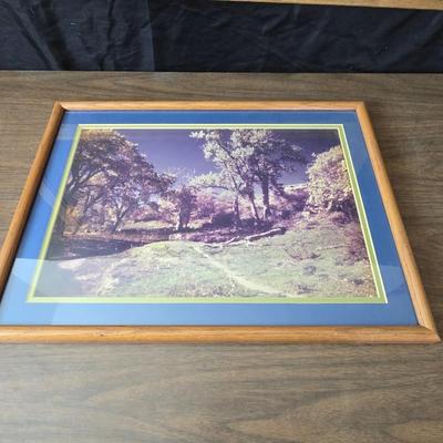 Framed print Laugh Kills Lonesome by artist Charles Marion Russell. with two other pieces of artwork