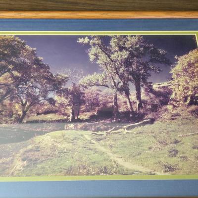 Framed print Laugh Kills Lonesome by artist Charles Marion Russell. with two other pieces of artwork