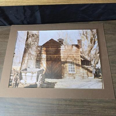 Framed print Laugh Kills Lonesome by artist Charles Marion Russell. with two other pieces of artwork