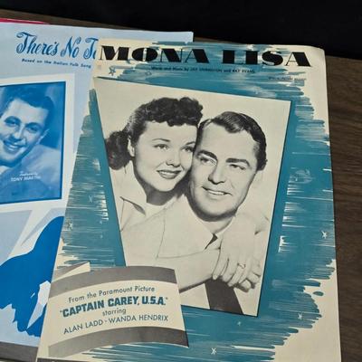 Super stamp collection booklets, Kenny Rogers pamphlet, Small historical booklets, books, and some sheets of music